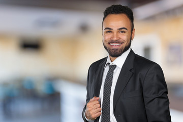 Fototapeta premium Handsome cheerful african american executive business man