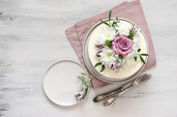 Fresh flowers decorated white cake