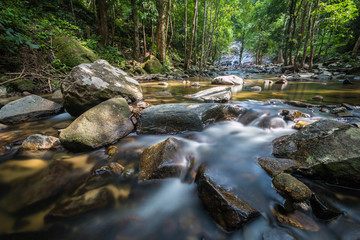 Long exposure shot.Waterfall with rocks in rainforest.
