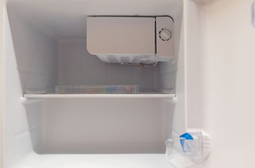 open empty new white refrigerator inside fridge with shelves .