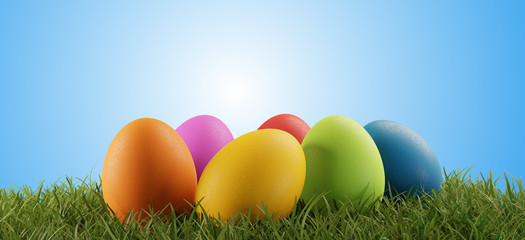 colorful Easter eggs green grass light blue blurred sky 3d-illustration