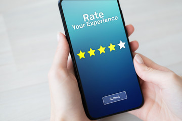 Rate your experience customer satisfaction review Five Stars on mobile phone screen. Business...