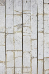 vertical texture of gray tiles on the wall