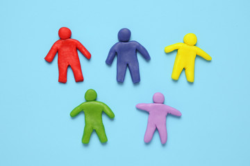 Multi сolored plasticine figures of people. Racial diversity and equality of people in world.