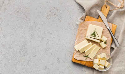 Block of butter on board