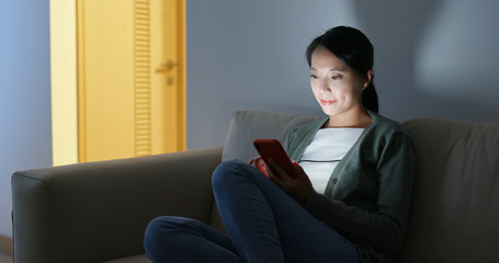 Woman use of mobile phone at night