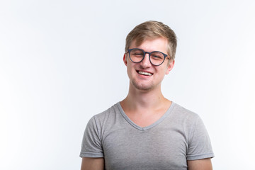 Geek, education, people concept - young man over the white background looks like he is a nerd