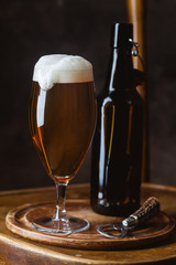 Glass beer on dark background with copy space