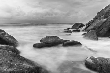 Fototapeta na wymiar Long exposure shot.Sea scape with stone beach at sunset,Motion blur,slow shutter speed.