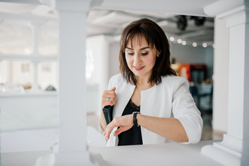  businesswoman on a coffee break. Using tablet computer.