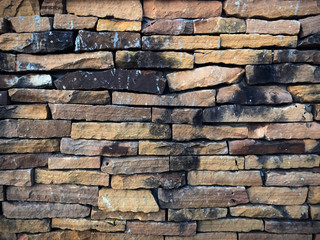 background of seamless texture of brown stone, dirty stone tile floor paving fragment, pattern texture of old rock, abstract background of stone wall