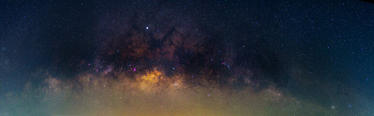 Panorama milky way at the lake with reflections in night time