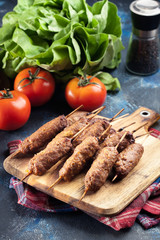 Grilled balkan cevapcici or  kebab on skewers
