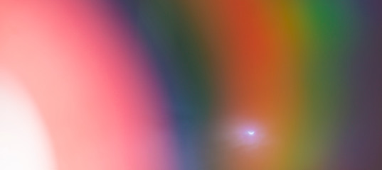 Colorful abstract background. Rainbow on CD with solar eclipse
