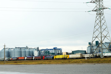 Obraz premium trucks in a line and granary plant