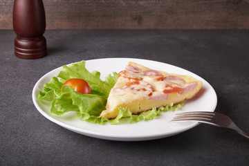 fresh pizza with hard cheese and cherry tomatoes and herbs