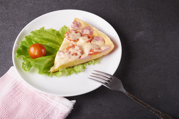 fresh pizza with hard cheese and cherry tomatoes and herbs