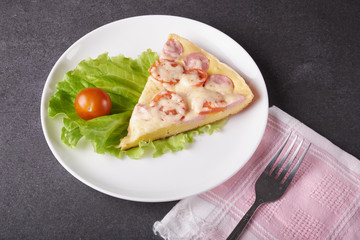 fresh pizza with hard cheese and cherry tomatoes and herbs