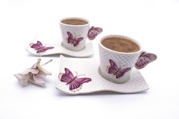 Coffee cup on a white background. Turkish coffee cup with ceramic frame Turkish coffee in a white cup isolated on a motifed background coffee cup with butterfly pattern