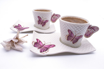 Coffee cup on a white background. Turkish coffee cup with ceramic frame Turkish coffee in a white cup isolated on a motifed background coffee cup with butterfly pattern