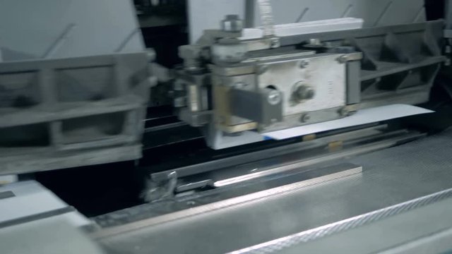 Paper covers are getting sticked to the parts of a moving machine