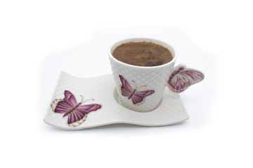 Coffee cup on a white background. Turkish coffee cup with ceramic frame Turkish coffee in a white cup isolated on a motifed background coffee cup with butterfly pattern