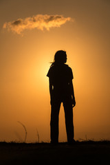 Silhouette woman at sunset.