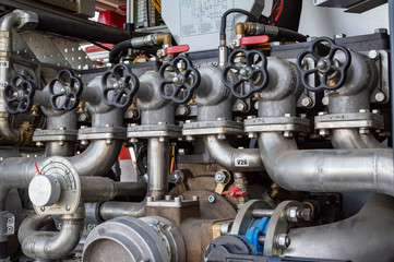 Close up on mechanics of a fire truck. Industrial, valves, mechanics.