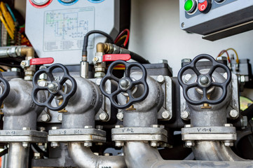 Close up on mechanics of a fire truck. Industrial, valves, mechanics.