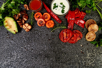 Obraz na płótnie Canvas Grilled vegetables on black background. Diet vegan food.