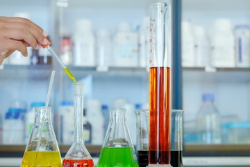 Chemical tube set development and pharmacy in laboratory  with multicolored substances in laboratory - Image