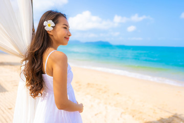 Fototapeta na wymiar Portrait beautiful young asian woman happy smile leisure on the beach sea and ocean