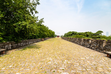 Fototapeta na wymiar May 2017 - Nanjing, Jiangsu, China - a section of the old Ming Dynasty city walls near Jiming temple. Nanjing has one of the best preserved city walls of China