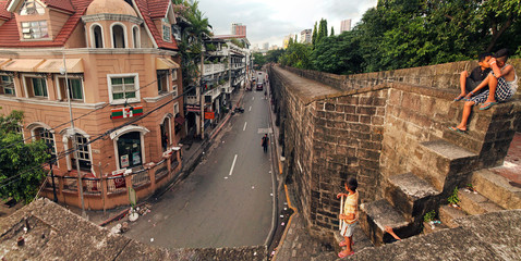 MANILA, PHILIPPINES - JUNE 18, 2018: Children walk around the fortress. The defensive fort of Fort...