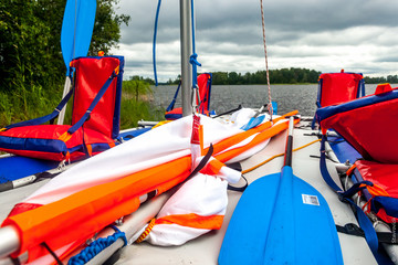 Four-seater catamaran on the bank of the river Vuoksa in Russia