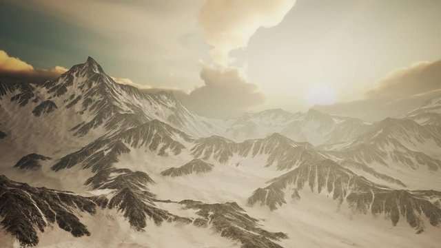 rays of sunset on the tops of the mountains on a sunny day