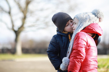 Children walk in the autumn park