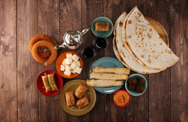 Middle eastern or arabic dishes and assorted meze, concrete rustic background. Turkish Bread or...