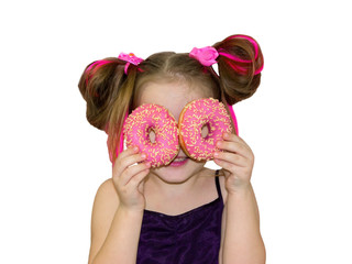 Little happy cute girl is eating donut on white background wall. Child is having fun with donut....
