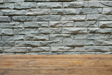 Gray block wall and wooden table
