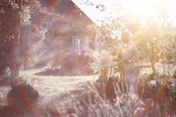 Man farmer watering a vegetable garden