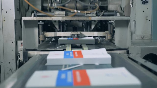 Newly-printed books are getting released by the industrial mechanism