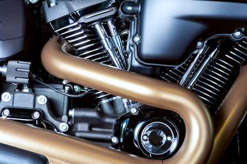 Motorcycle internal combustion engine with air cooling, close-up, detail, macro. Engine parts, cylinder head, ignition, exhaust pipe, air-intake manifold - obrazy, fototapety, plakaty