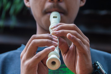 A man playing recorder