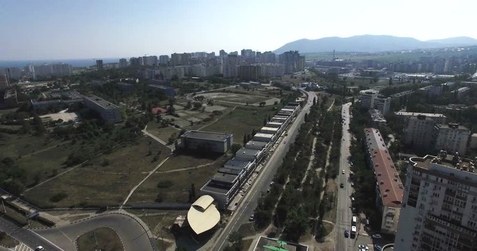 Aerial. City. Houses. Cars
