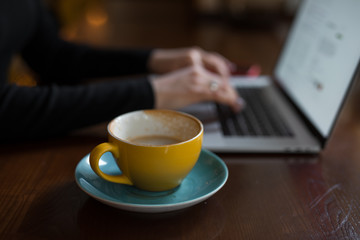 Woman hands on a laptop keyboard working typing text
