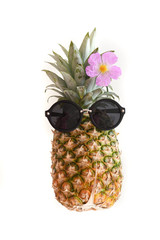 pineapple in sunglasses on a white background