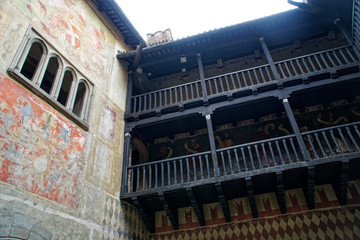 Medieval wooden gallery of the second floor in an old stone castle
