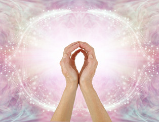 Healer sending Unconditional Love Healing Energy -  female hands reaching up making an O shape with...