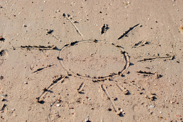 Sun drawing in the sand